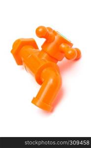 orange plastic faucet on a white background
