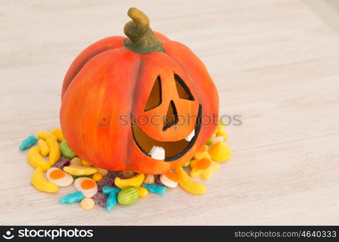 Orange pumpkin halloween with many baubles.