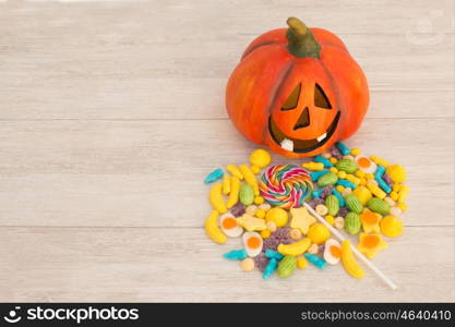 Orange pumpkin halloween with many baubles.