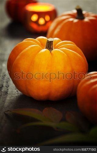Orange pumpkins on a wooden background