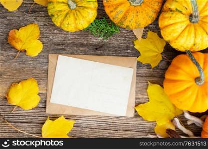 orange raw pumpkins on old wooden textured table, top view frame. pumpkin on table