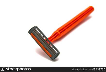 orange razor blades on white