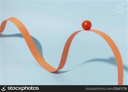 orange ribbon with ball