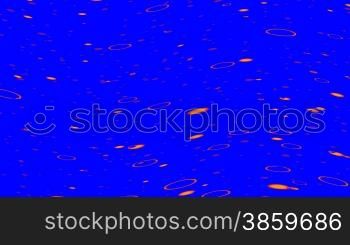Orange rings float on waves on a dark blue background