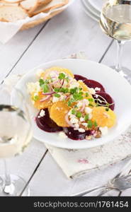 Orange salad with baked beetroot, goat cheese, microgreens and nuts. Perfect as a side dish or as a light lunch for a brunch or dinner.