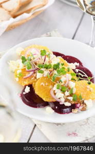 Orange salad with baked beetroot, goat cheese, microgreens and nuts. Perfect as a side dish or as a light lunch for a brunch or dinner.