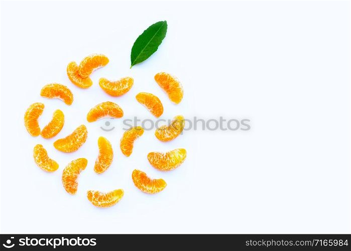 Orange segments with leaf on white background. Copy space