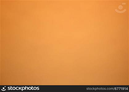 Orange sheet of cardboard with a smooth and delicate surfaces.Ideal for background.