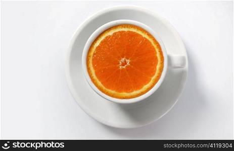 Orange slice in a coffee cup