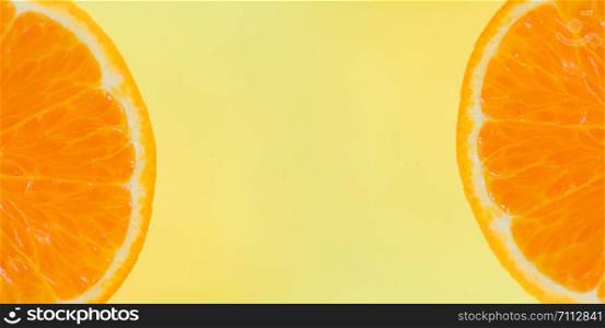 orange slice on yellow background / close up of fresh Orange fruit , top view macro fruit