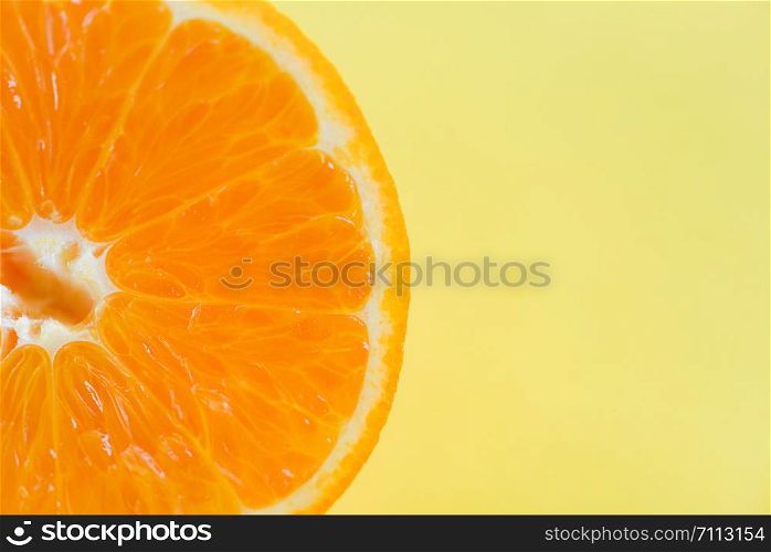 orange slice on yellow background / close up of fresh Orange fruit , top view macro fruit