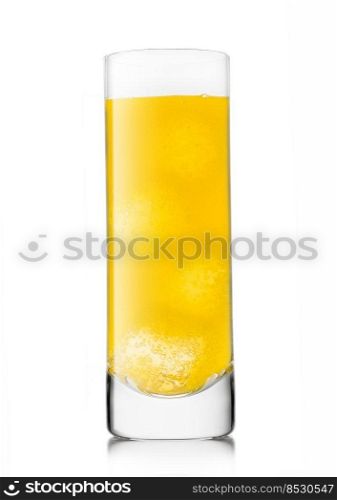 Orange soda drink with ice cubes in highball glass on white.