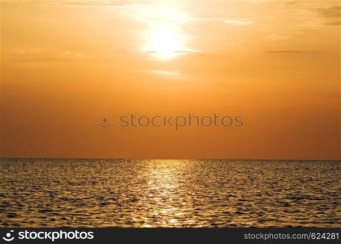 Orange sunset above a quiet serene gulf