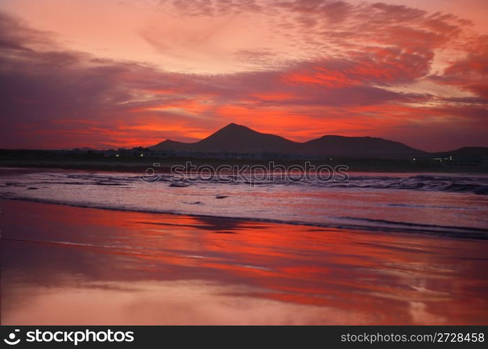 orange sunset in playa Famara, Lanzarote