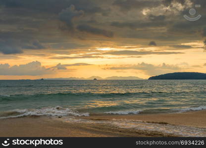 orange sunset in Thailand in golden tones, beautiful clouds over the sea