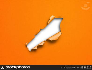 Orange torn paper with hole. blank background template. Orange torn paper with hole
