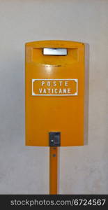 Orange Vatican post box on Saint Peter Square. Rome. Italy.