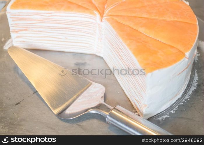 Orange whipped cream crepe cake, stock photo