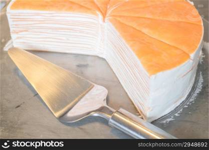 Orange whipped cream crepe cake, stock photo