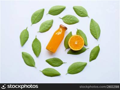 Orange with green leaves and Orange juice isolated on white background. Top view