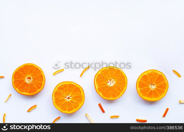 Orange with peels on white background.