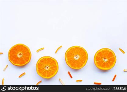 Orange with peels on white background.