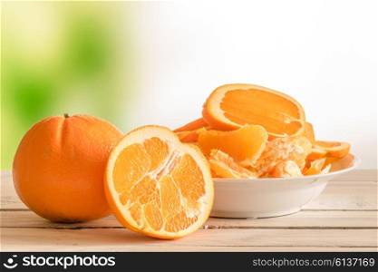 Oranges in half on a wooden table