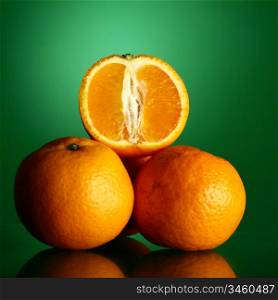 oranges isolated on green background