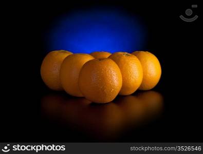 oranges like billiard balls isolated on black