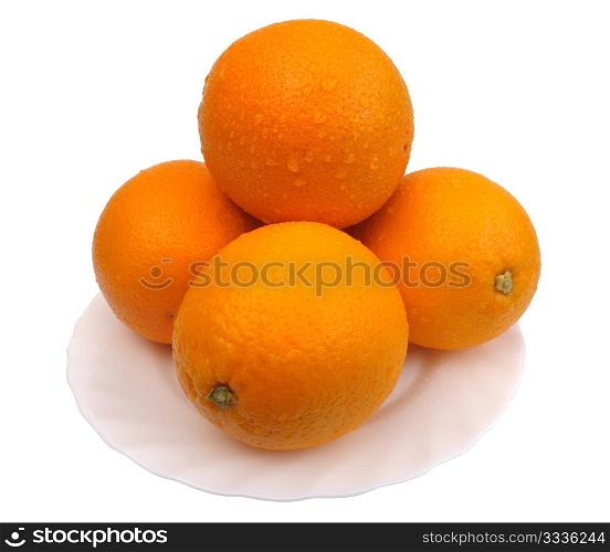 Oranges on a white plate on a white background, isolated