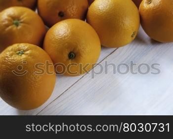 oranges on weathered wooden table. Fresh oranges on wooden background