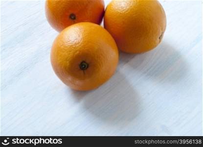 oranges on wooden background.. oranges lie on the old wooden background.