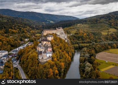 Oravsky Podzamok, Slovakia - 28 September, 2022  aerial landscape of Orava Castle and the village of Oravksy Podzamok in late autumn