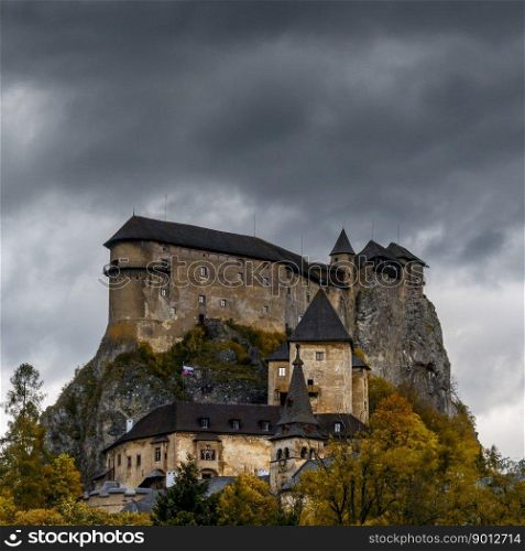 Oravsky Podzamok, Slovakia - 28 September, 2022: view of the medieval Orava Castle in autumn under an overcast stormy sky