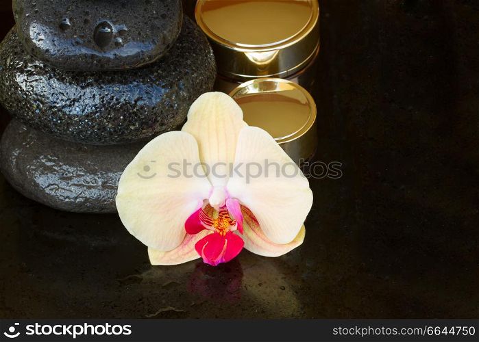 orchid flower spa treatment with massage stones