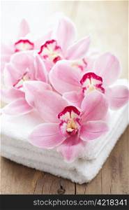 orchid flowers and towels for spa