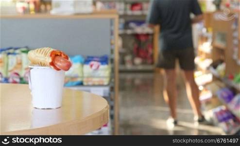 Order hot dog and coffee cup in convenient store