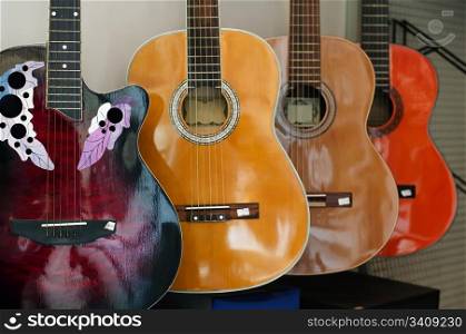 Ordered acoustic guitars in shop. Close up
