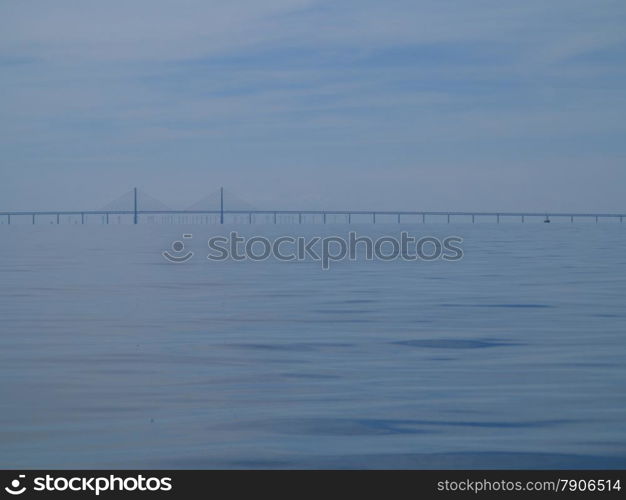 Oresundsbron. The Oresund bridge link between Denmark and Sweden, Europe, Baltic Sea. View from sailboat. Overcast stormy sky.