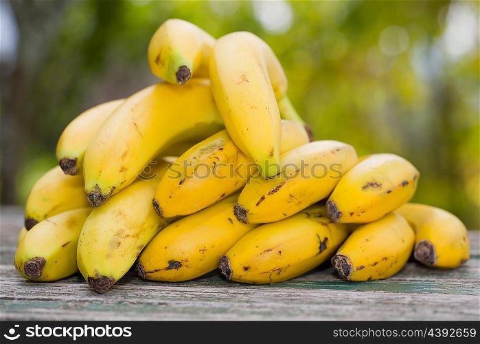 organic bananas on the wooden table at the farm, outdoor
