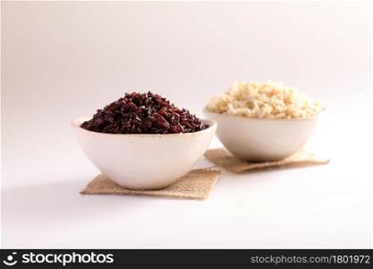 Organic boiled brown rice on bowl isolated in white background