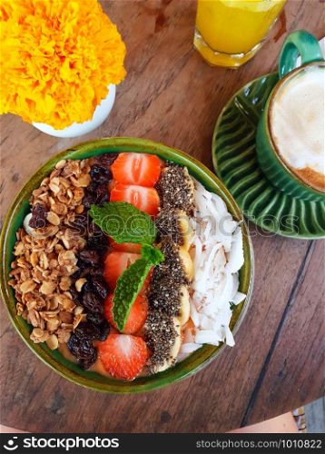 Organic Breakfast muesli yogurt, topped with strawberries banana, chia seeds and coconut restaurant. Organic Breakfast muesli yogurt, topped with strawberries banana, chia seeds and coconut