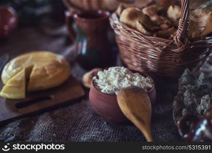 Organic domestic food. Organic domestic food: cheese , cottage cheese on rustic background