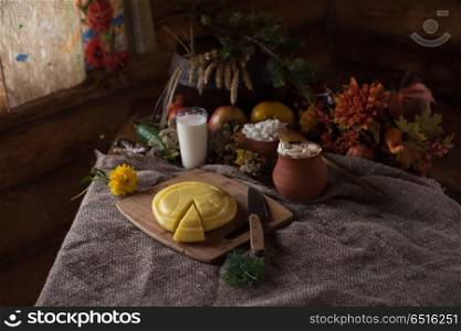 Organic domestic food. Organic domestic food: milk cottage cheese sour cream boiled potato and vegetables in vintage dish on rustic background