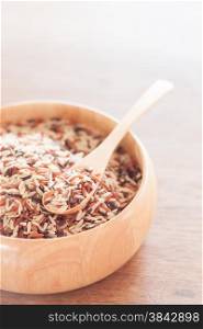 Organic Dry Multi Grain Rice in wooden bowl, stock photo