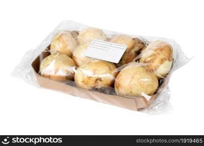 Organic dry onions in cardboard packaging on a white background