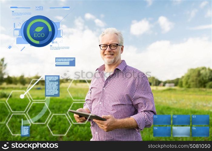 organic farming, agriculture and people concept - happy senior man with tablet pc computer at county or farm. senior man with tablet pc computer at county