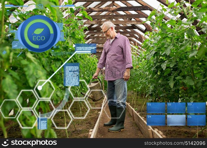 organic farming, agriculture and people concept - happy senior man with watering can at farm greenhouse. senior man with watering can at farm greenhouse