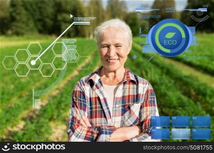 organic farming, agriculture and people concept - happy senior woman at farm. happy senior woman at farm