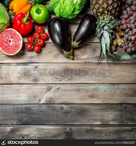 Organic food. Fresh fruits and vegetables. On a wooden background.. Organic food. Fresh fruits and vegetables.